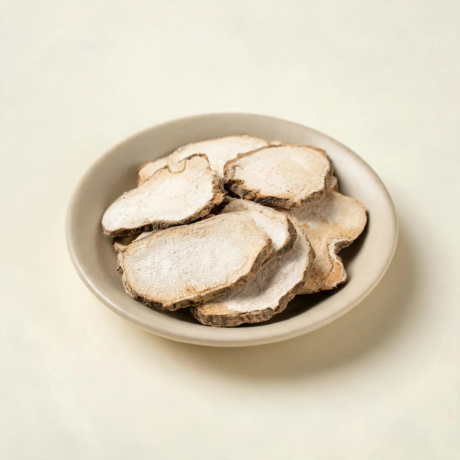Dried Bi Xie rhizome arranged in a shallow bowl