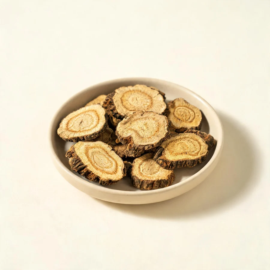 Dried Cang Zhu rhizome arranged in a shallow bowl
