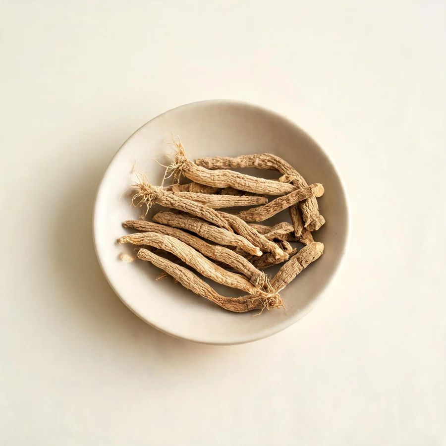 Dried Chai Hu root arranged in a shallow bowl