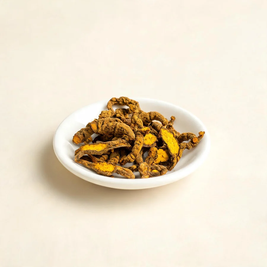 Dried Huang Lian rhizome arranged in a shallow bowl