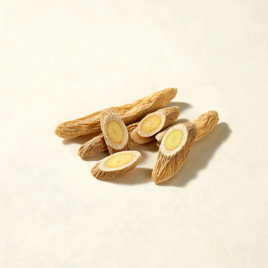 Dried Huang Qi root arranged in a shallow bowl