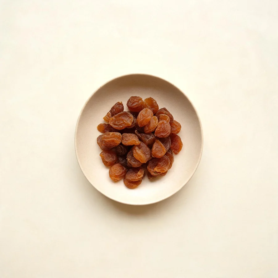 Dried Long Yan Rou fruit arranged in a shallow bowl