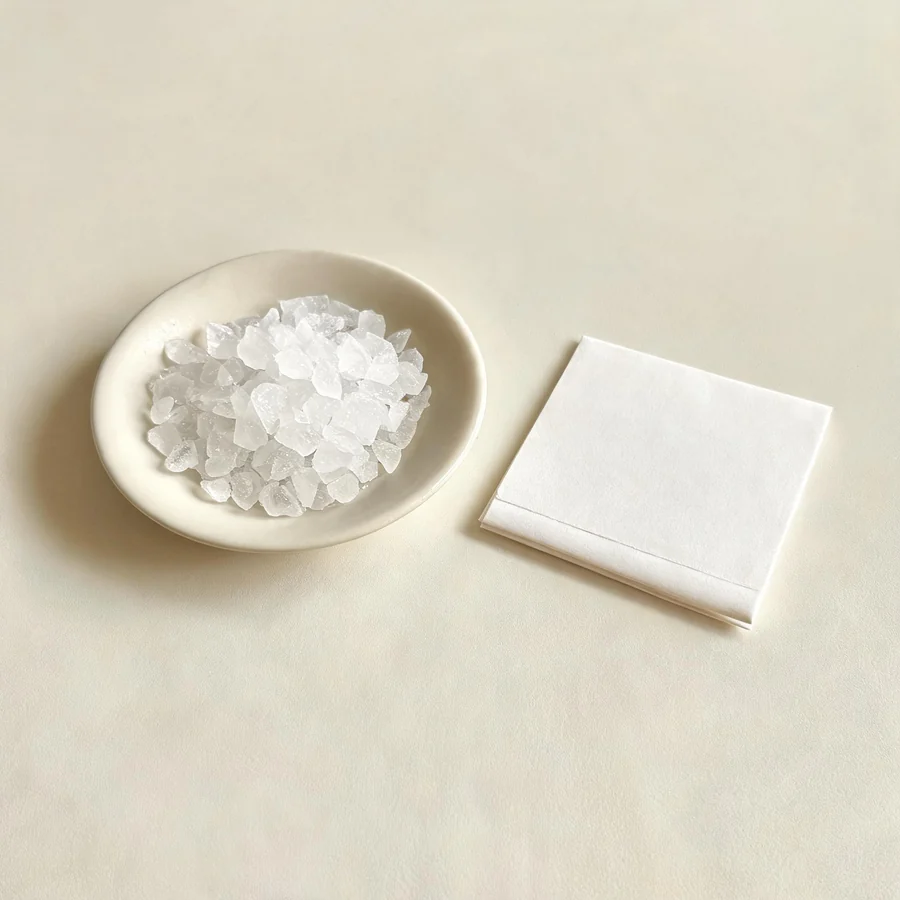 Dried Mang Xiao refined salt crystal arranged in a shallow bowl