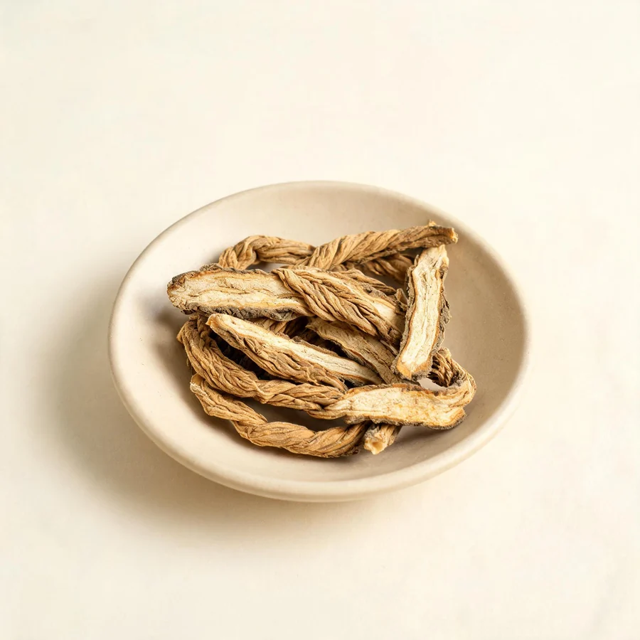 Dried Qin Jiao root arranged in a shallow bowl