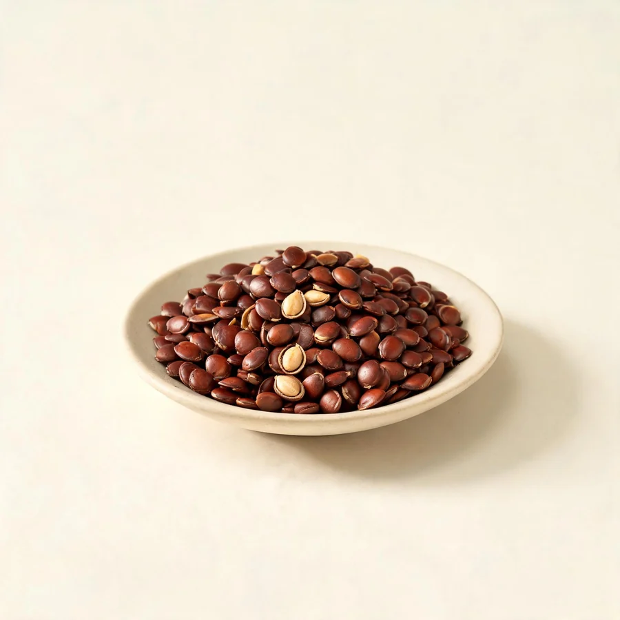 Dried Suan Zao Ren seed arranged in a shallow bowl