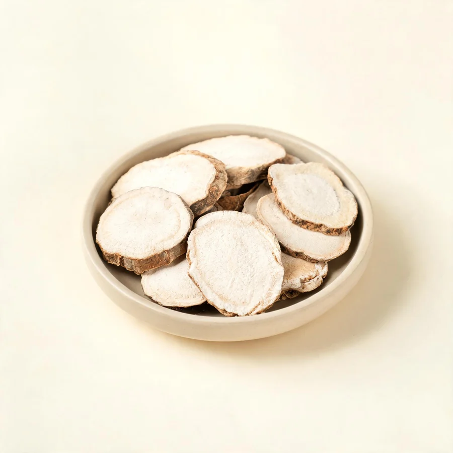 Dried Tu Fu Ling rhizome arranged in a shallow bowl