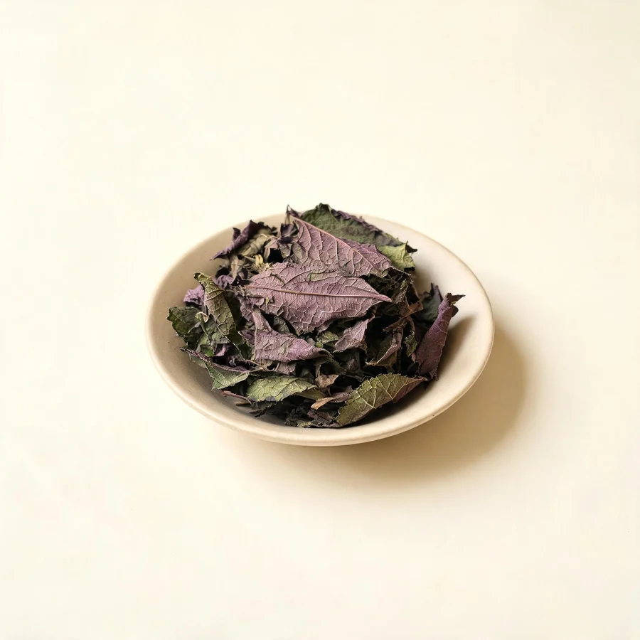 Dried Zi Su Ye leaf arranged in a shallow bowl